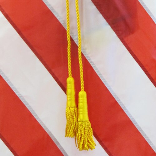 yellow tassels on striped backgroun