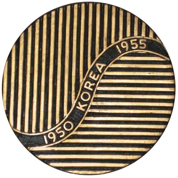 Close-up of a circular emblem with gold and black vertical stripes and the text "1950 KOREA 1955" engraved, featured on a Plastic US Veteran Grave Marker.