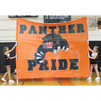 cheerleaders holding panther banner