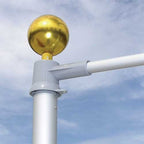golden sphere on gray pole