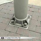 Pole base on brick pathway