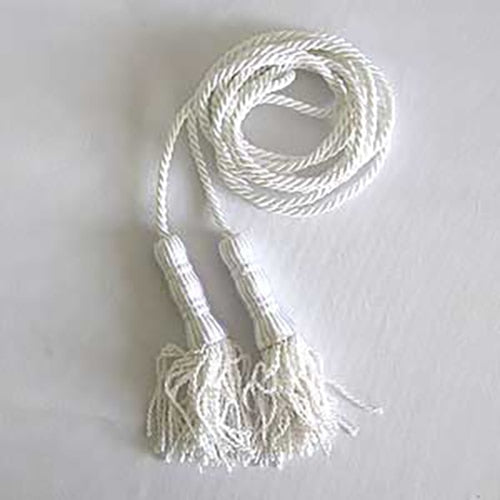 white rope with tassels lying flat
