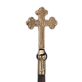 golden cross on wooden handle
