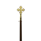 golden cross on wooden staff