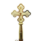 gold cross on wooden handle