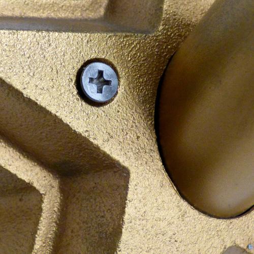 gold textured surface with screw