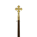 gold cross on wooden staff