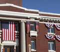 American flags on brick building