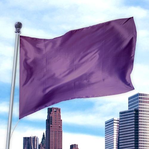 Solid Colored Flags - Premier Nylon flag in purple flying against a city skyline with modern buildings under a partly cloudy sky.