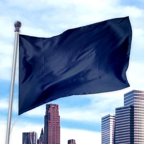Dark blue solid flag made of nylon fabric waving on a flagpole with a city skyline in the background, Solid Colored Flags - Premier Nylon