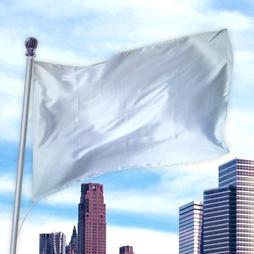White solid colored flag made of premier nylon waving on a flagpole with a city skyline background featuring multiple high-rise buildings, Solid Colored Flags - Premier Nylon.
