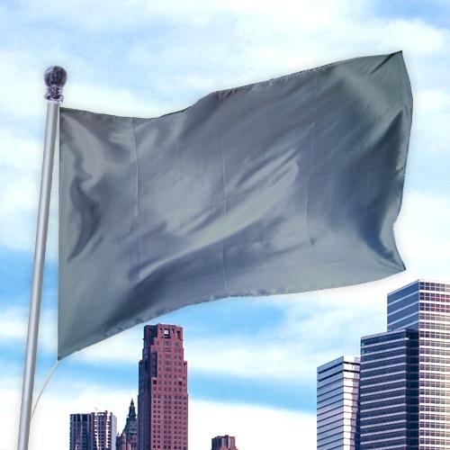 Gray flag made of durable fabric flying on a pole above city skyscrapers, Solid Colored Flags - Premier Nylon