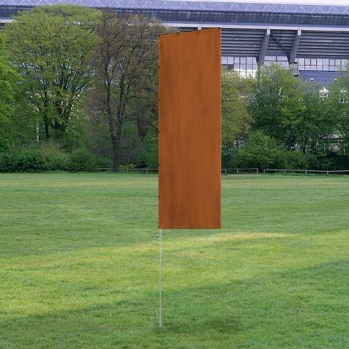Solid Tall Advertising Flags in a rust-colored fabric stand upright on a metal pole on a grassy field near trees and a stadium.