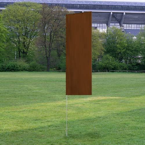 Solid Tall Advertising Flags with a plain brown design standing upright on a metal pole in a grassy outdoor area near trees and a stadium.
