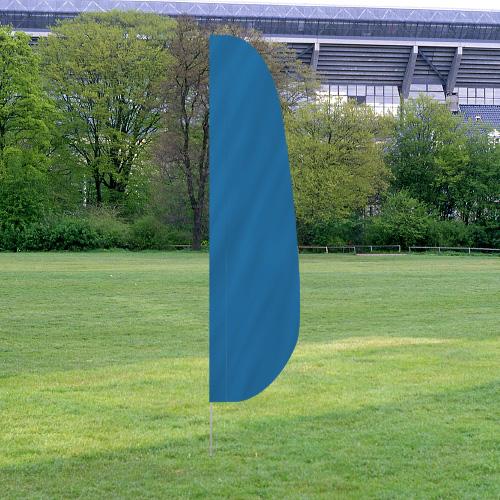 Solid Color Feather Flags displayed outdoors on grass with trees and a stadium structure in the background, featuring a solid blue color.