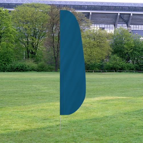 Solid Color Feather Flags in turquoise standing outdoors on grass with trees and a stadium in the background.