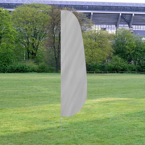 Solid Color Feather Flags in white set outdoors on green grass with trees and a large building in the background.