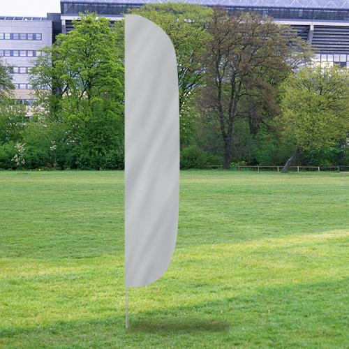 Solid Color Flutter Flags in a neutral light gray standing on a grassy field with trees and buildings in the background.