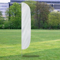 Solid Color Flutter Flags in white displayed outdoors on a grassy lawn with trees and buildings in the background.