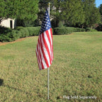 American flag on pole in lawn