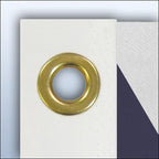 gold grommet on white fabric