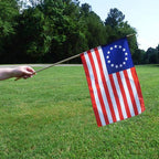 historic betsy ross flag held outsi
