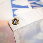 NESA gold grommets on Flag