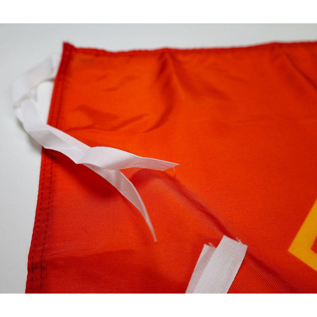 white tie straps on flag