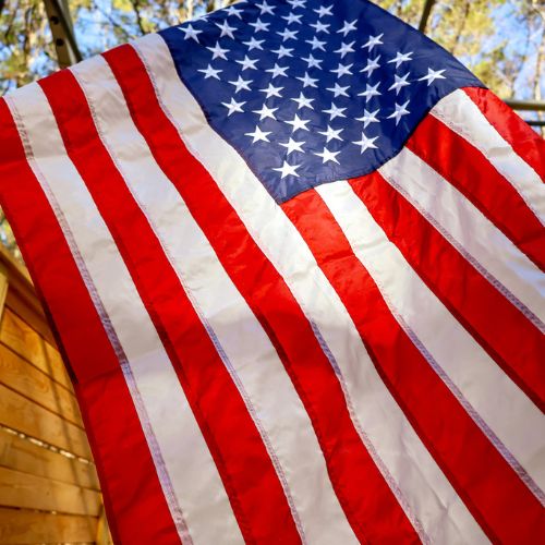 Annin Signature American flag hanging outdoors with vivid colors and stitched stripes
