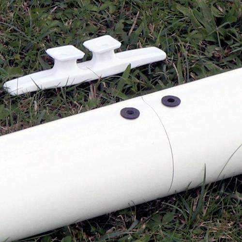 white pulley on white pipe grass