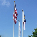 flags fluttering in bright sky