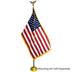 US flag mounted on a gold stand