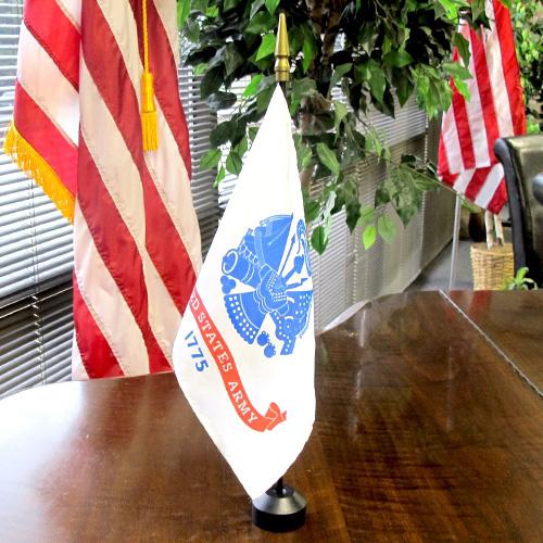 US Army flag on wooden table