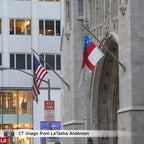 flags flying outside building