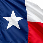 Close-up of Texas Extreme Reinforced Outdoor Flags showing a blue field with a white star next to horizontal white and red stripes made from durable fabric.