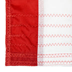 Close-up of red and white reinforced stitching on durable fabric edge showcasing the quality of Texas Extreme Reinforced Outdoor Flags.