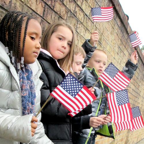 Kids holding safety style flags