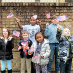 Kids waving mini U.S. flag