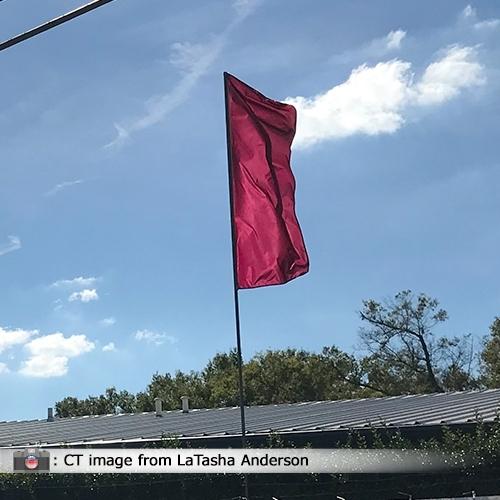 red flag waving in the wind