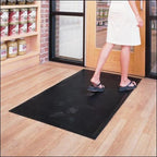 woman walking on black mat